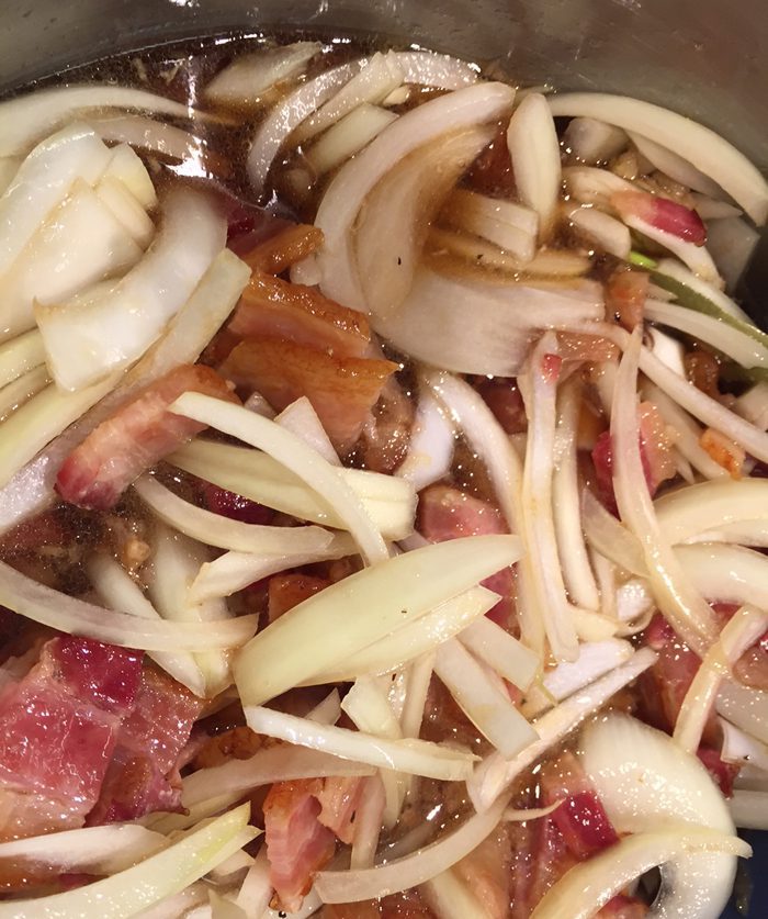 A picture of sliced bacon and onions